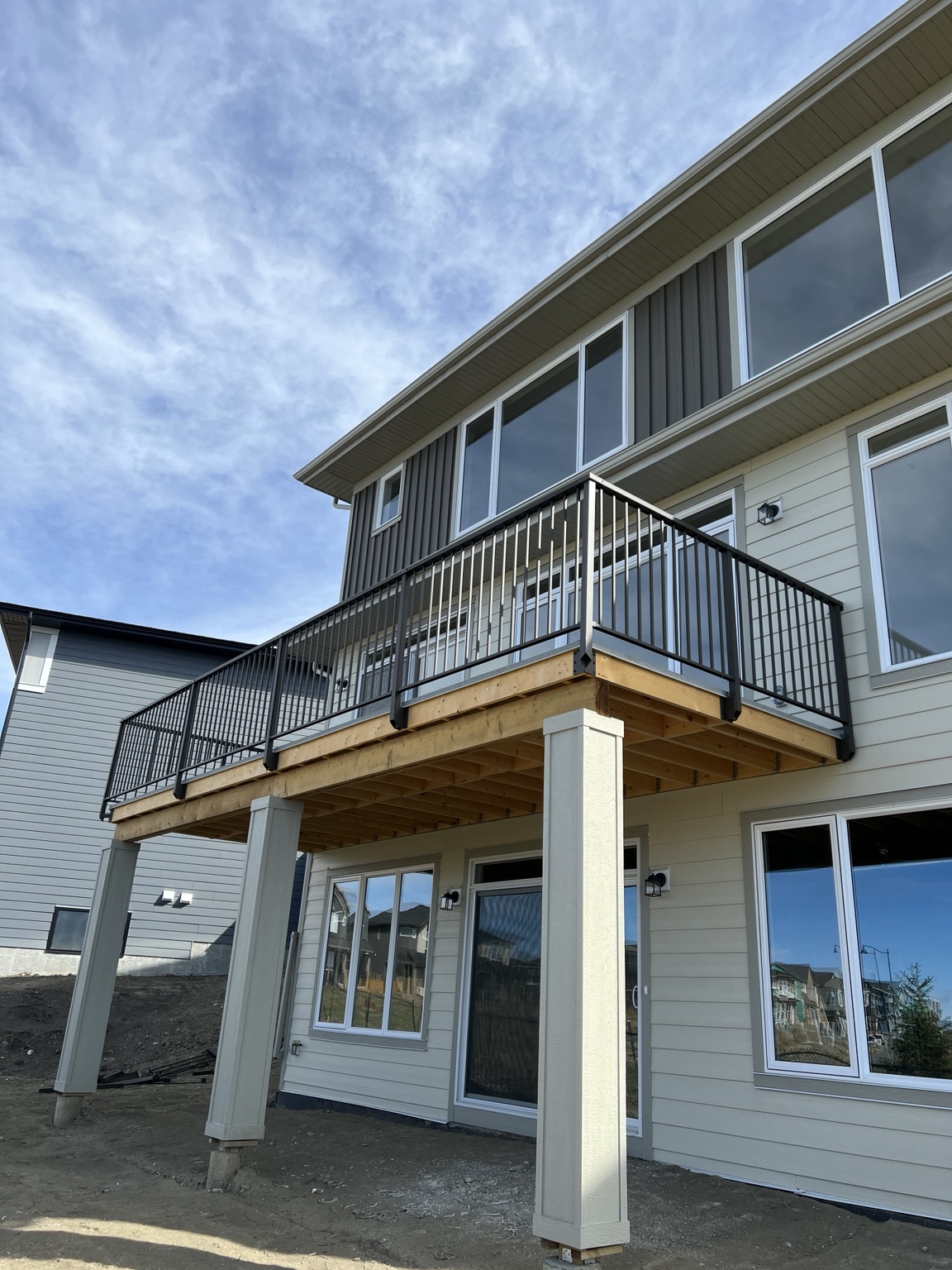 Elevated custom deck with black aluminum railing