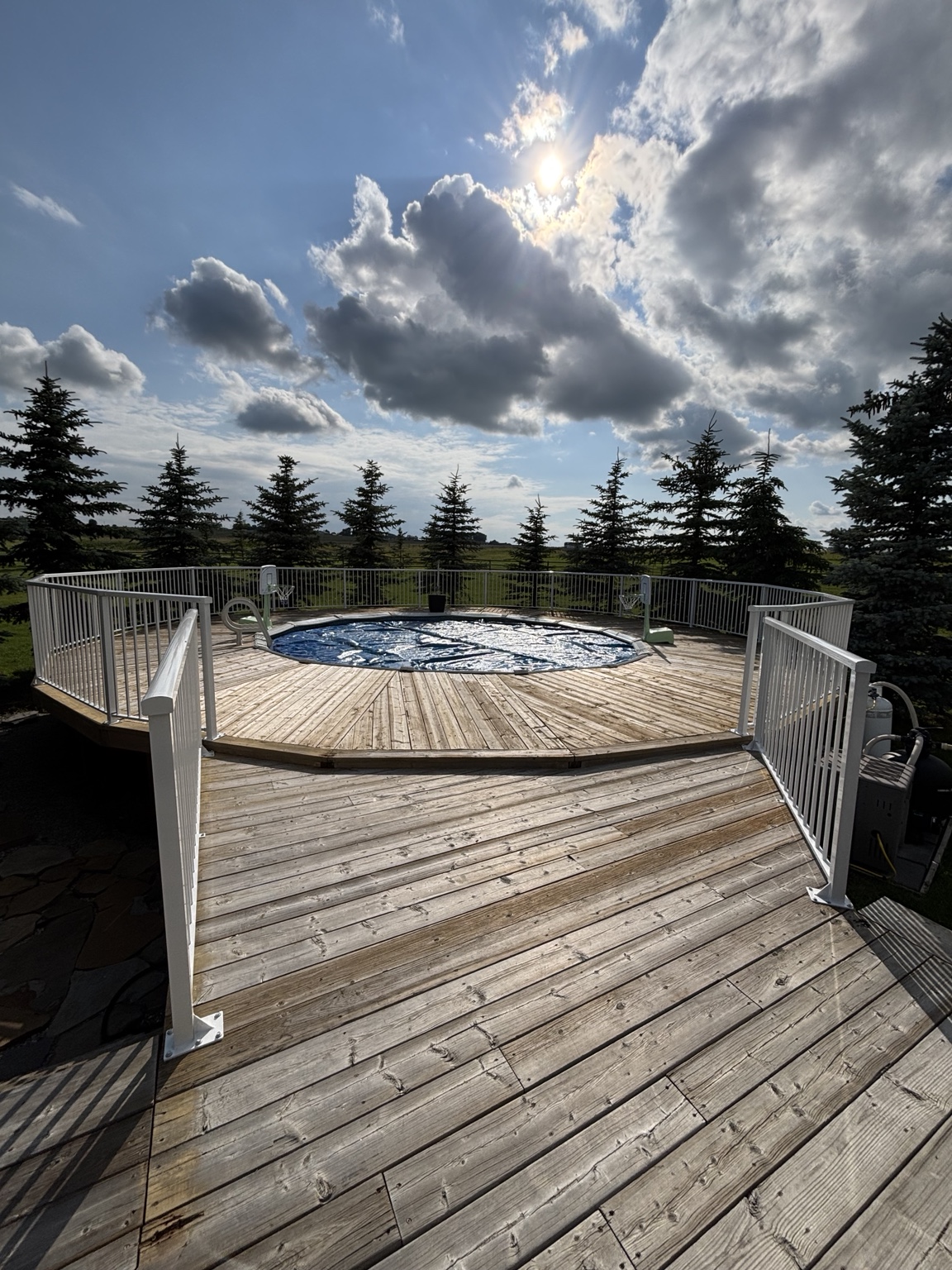 Wood pool deck with aluminum safety railing