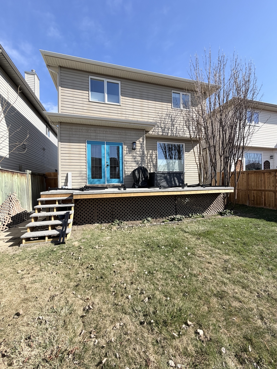 Wide view of the completed backyard deck renovation