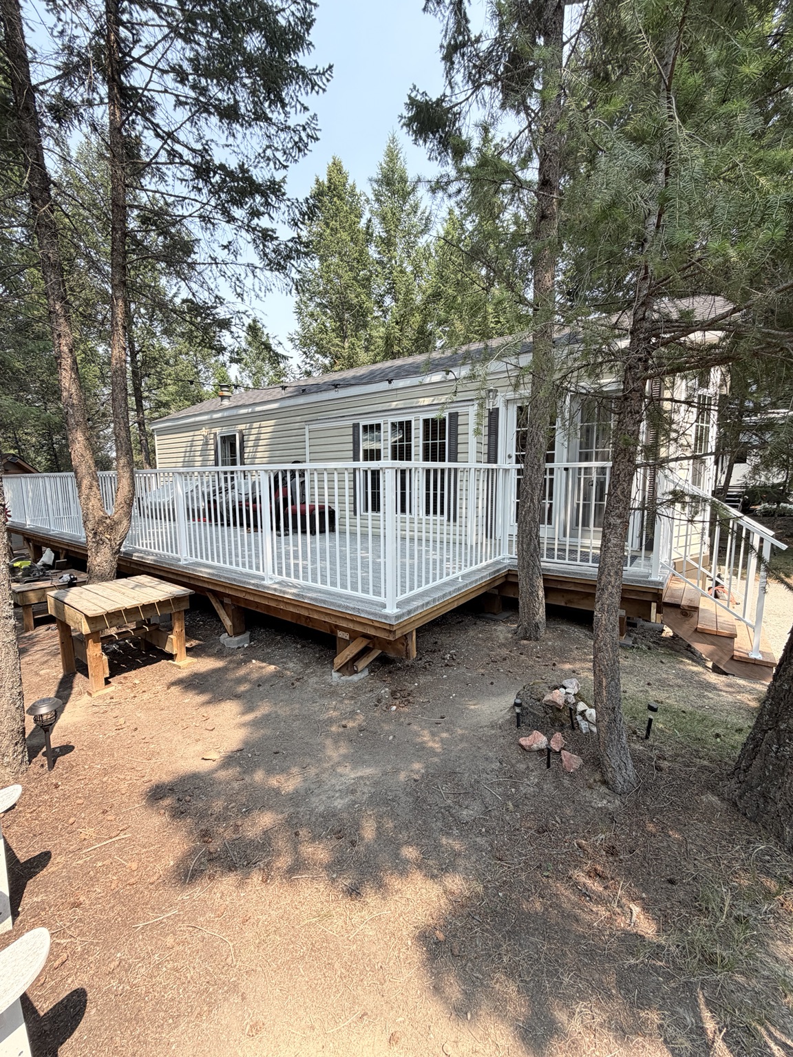 Large wraparound deck with white railings